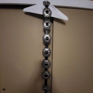 Black leather belt with large conchos and buckle